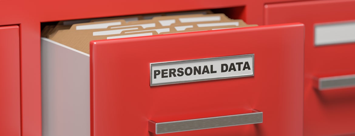 A red file cabinet holds files labeled as Personal Data. 