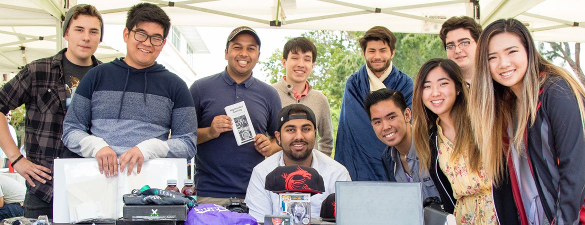 Members of students organizations at UCR pose for a picture during a campus event. 